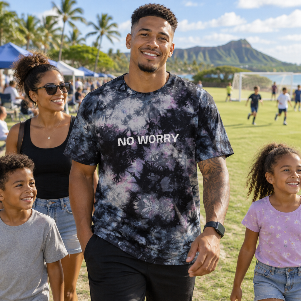 Lifestyle photo of the No Worry embroidered black and white tie-dye shirt outdoors
