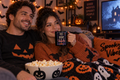 Dance Until Midnight Halloween mug with skeleton ballerinas held in a cozy fall setting