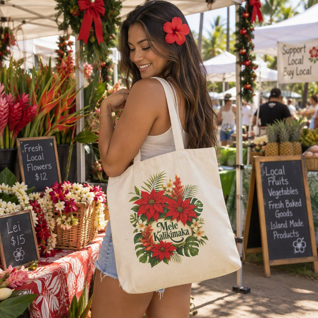 Woman carrying Mele Kalikimaka floral tote bag at a farmers market