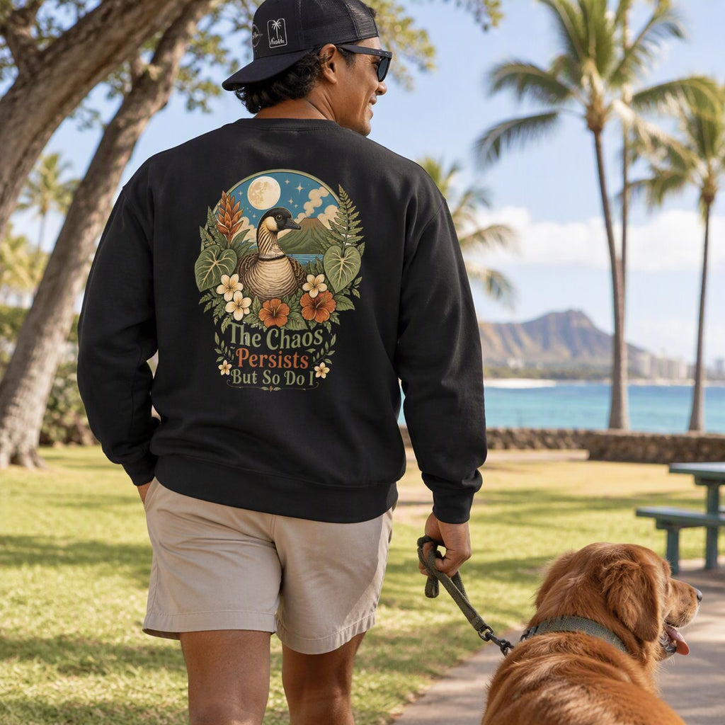 Back view of Vintage Goose Chaos Persists crewneck in black at the beach park