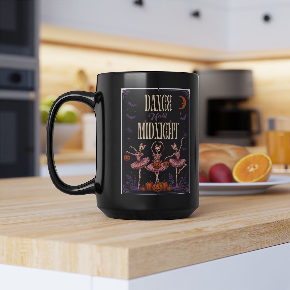 Dance Until Midnight Halloween mug with skeleton ballerinas held in a cozy fall setting