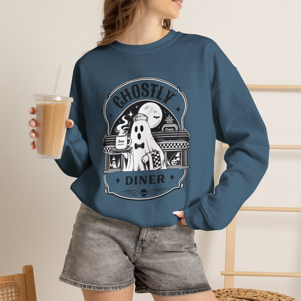 Lifestyle photo of the Ghostly Diner sweatshirt in a fall setting