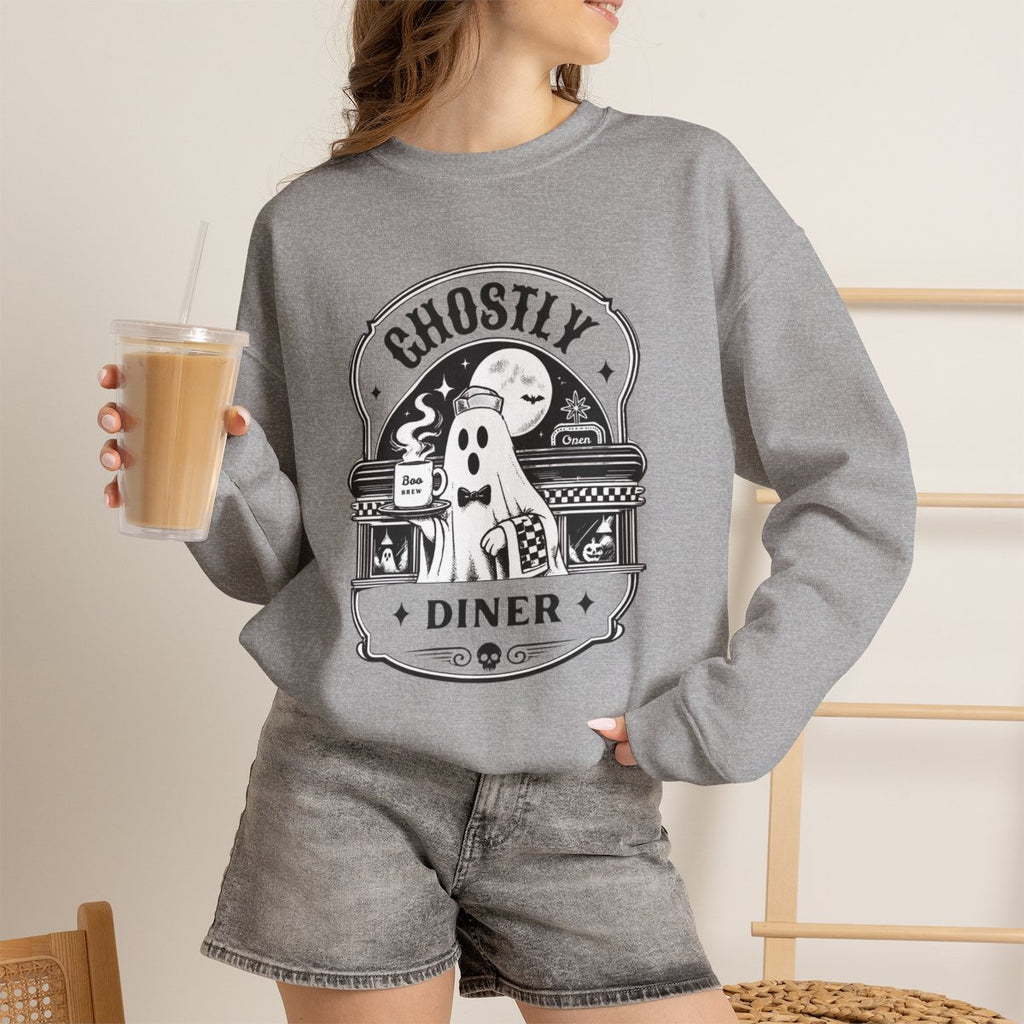 Lifestyle photo of the Ghostly Diner sweatshirt in a fall setting