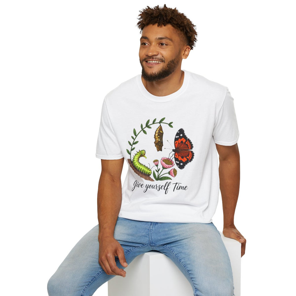 Man sitting wearing the white Give Yourself Time butterfly transformation tee