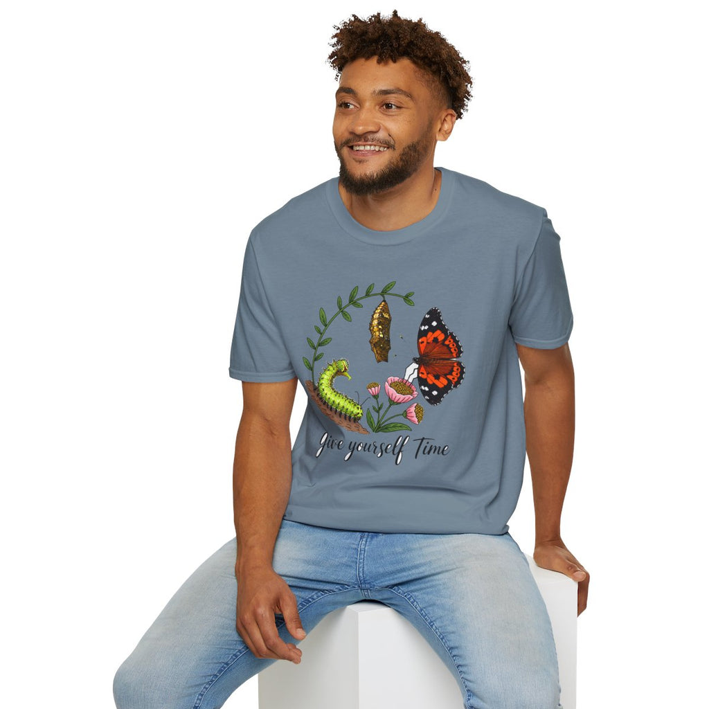 Man sitting wearing the stone blue Give Yourself Time butterfly transformation tee