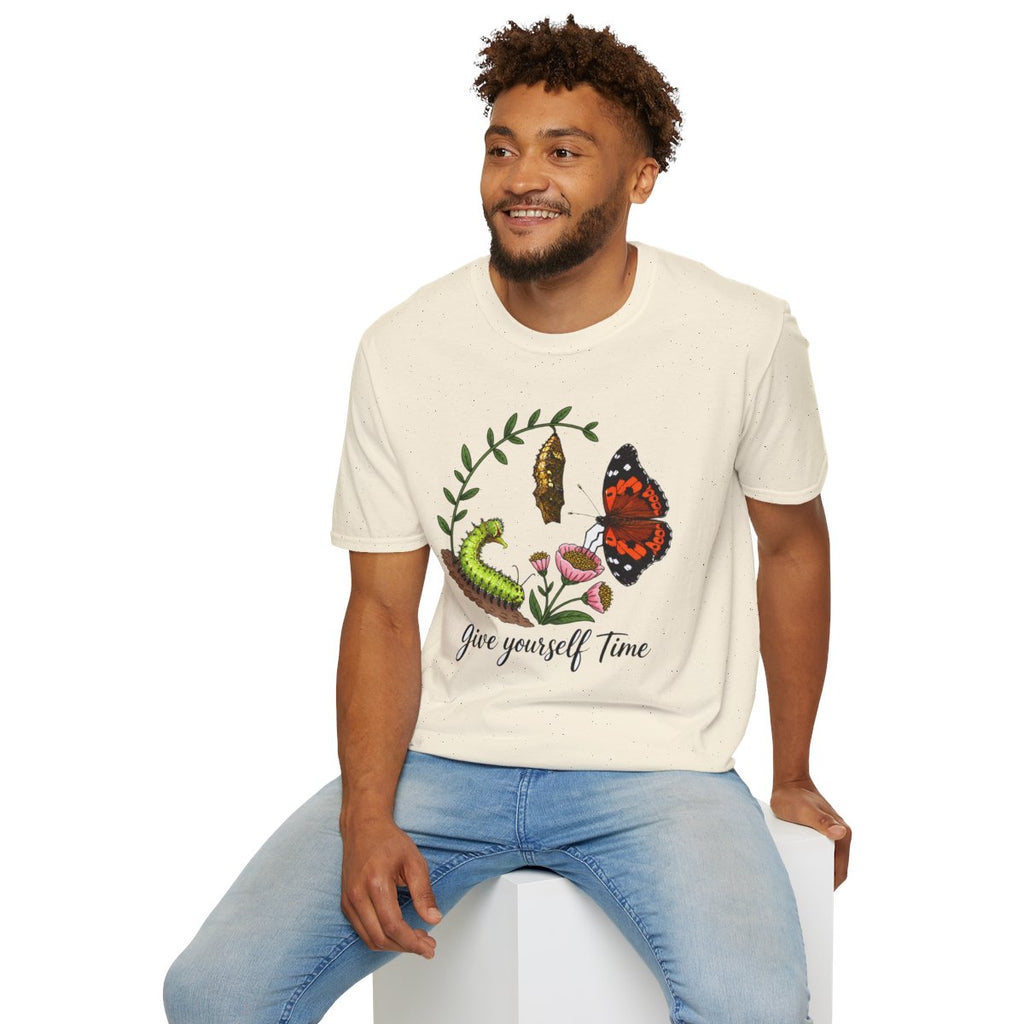 Man sitting wearing the natural Give Yourself Time butterfly transformation tee