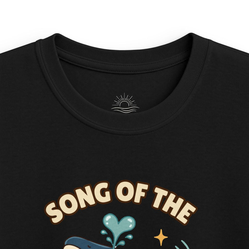 Close-up of the black Song of the Sea whale kids tee print and neck logo
