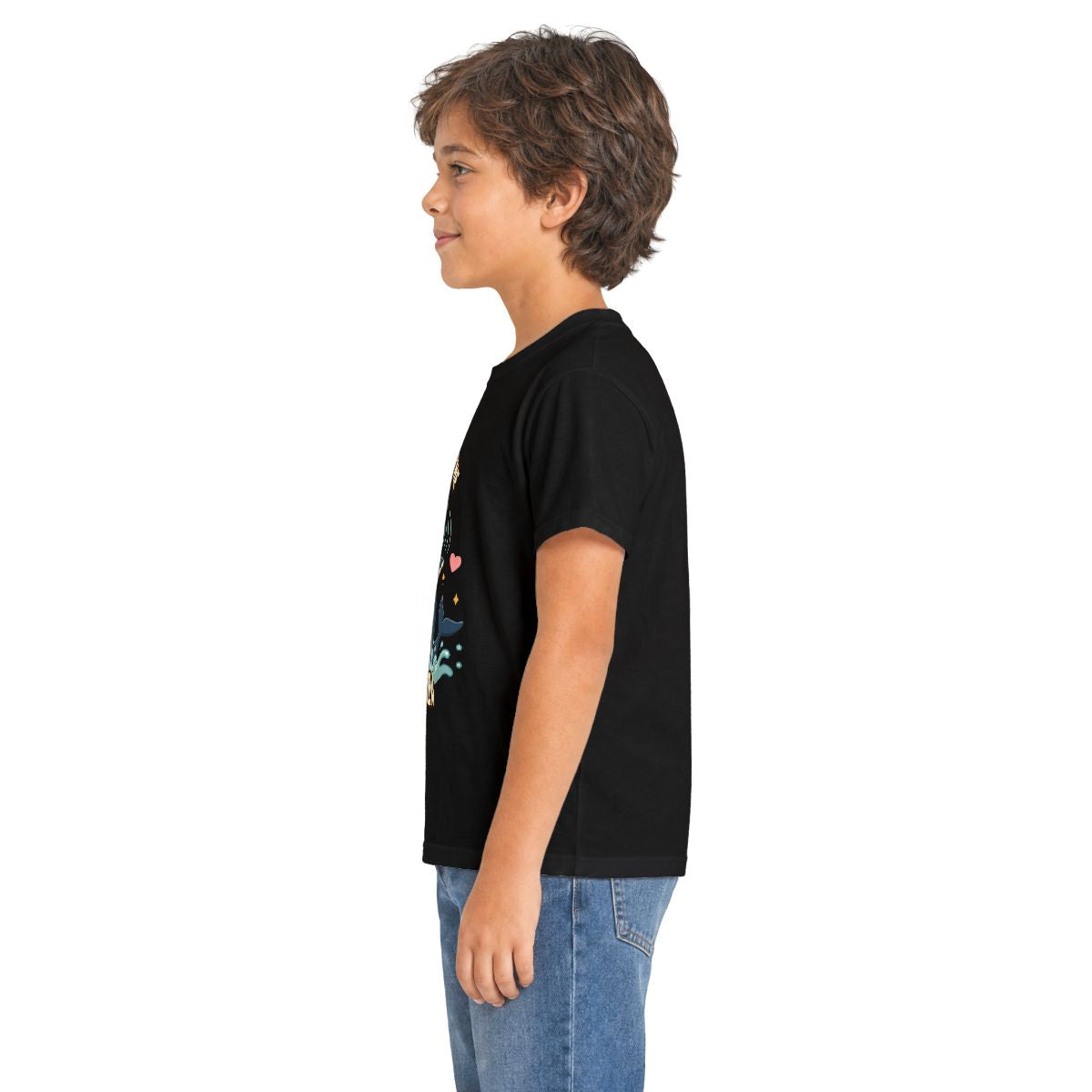 Boy in profile wearing the black Song of the Sea whale kids tee