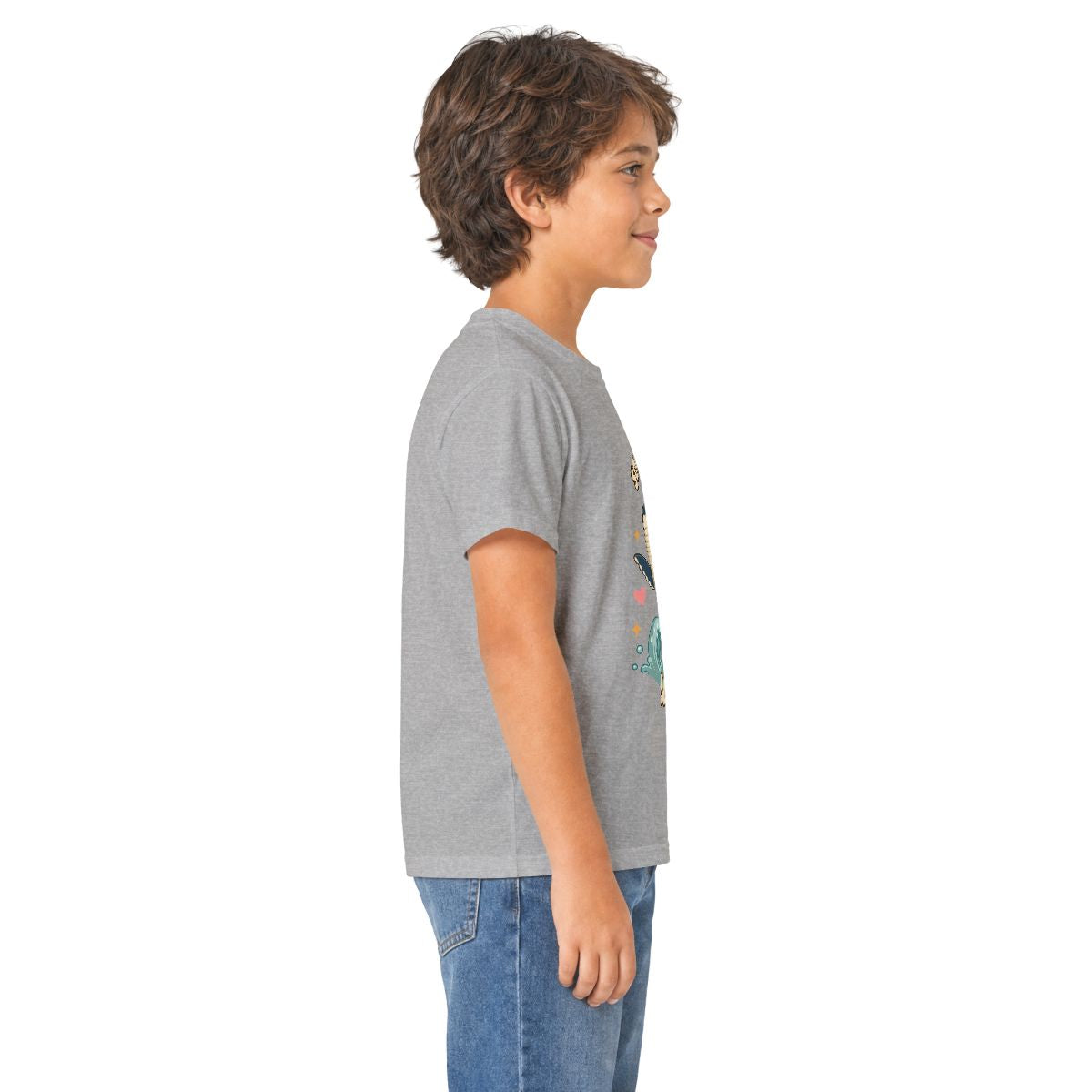 Boy in profile wearing the sport grey Song of the Sea whale kids tee, other side
