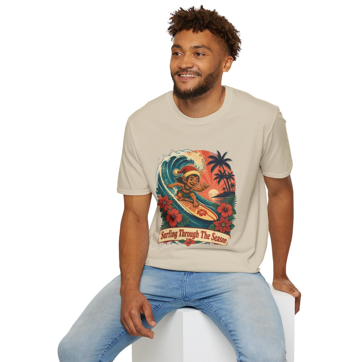 Menehune Surfing Through The Season tee in Sand - seated model