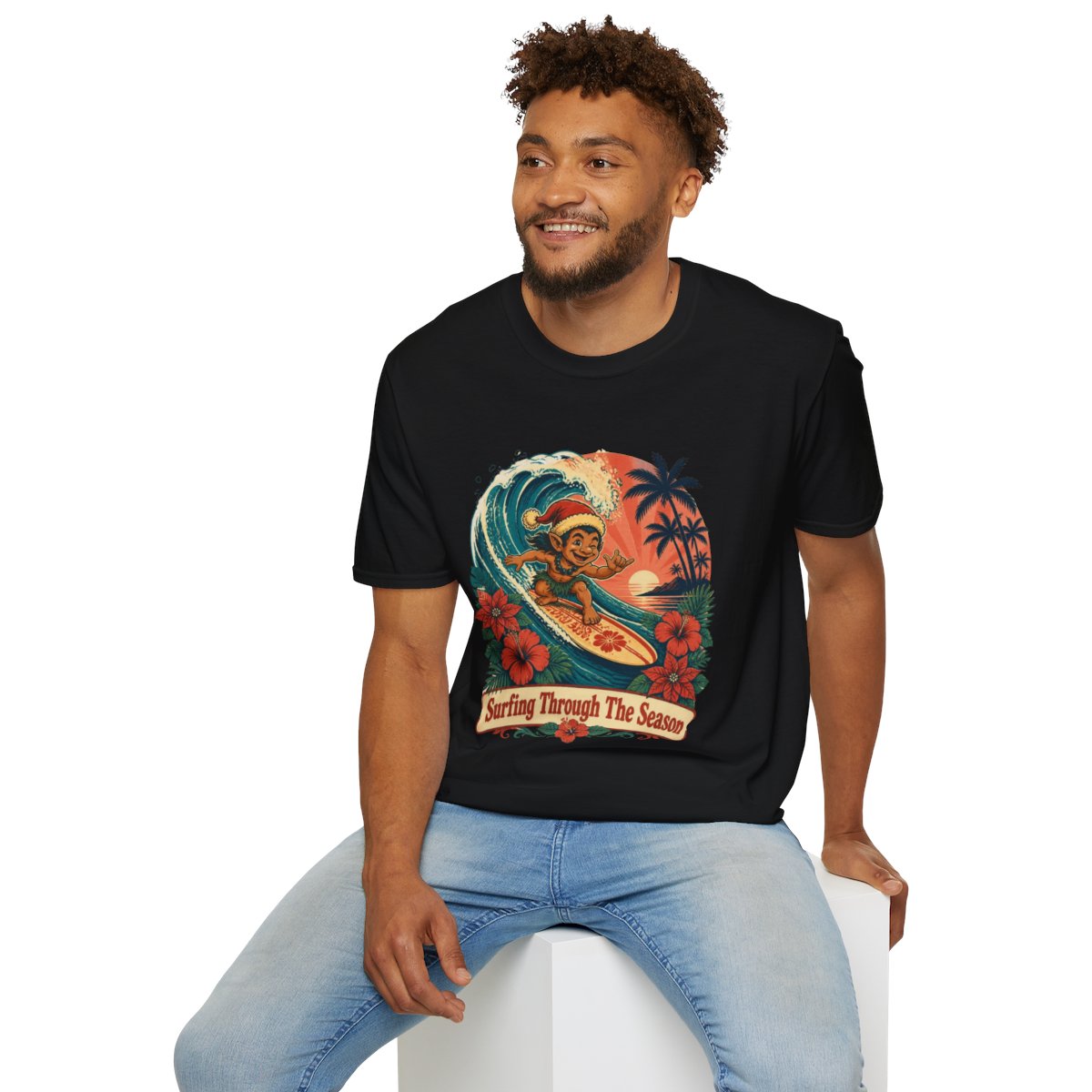 Menehune Surfing Through The Season tee in Black - seated model
