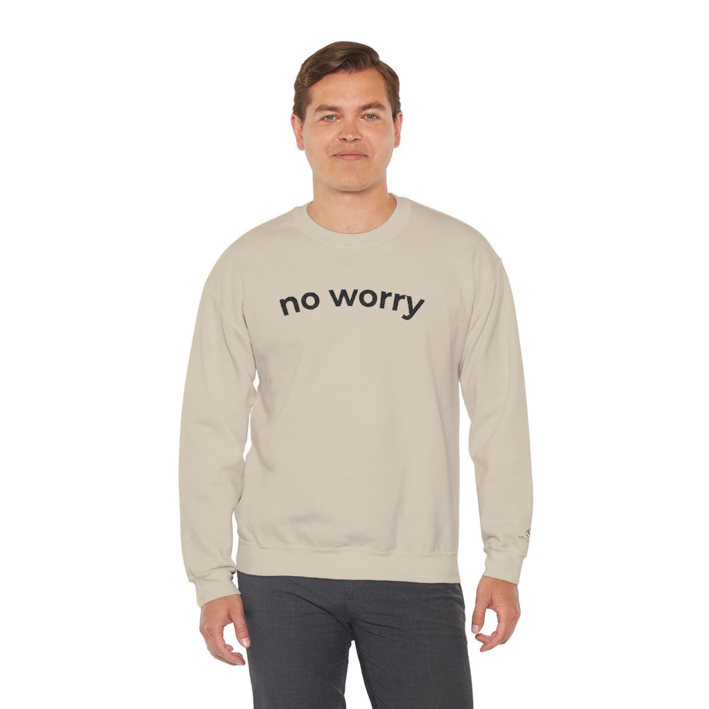 Man standing wearing the sand No Worry crewneck, second model