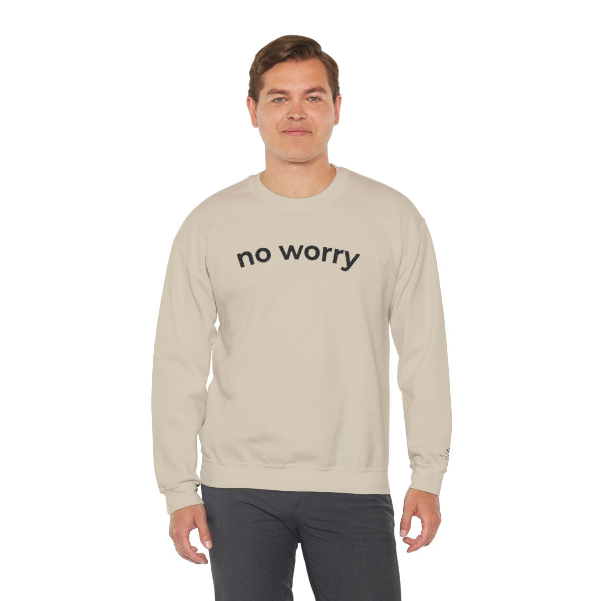 Man standing wearing the sand No Worry crewneck, second model