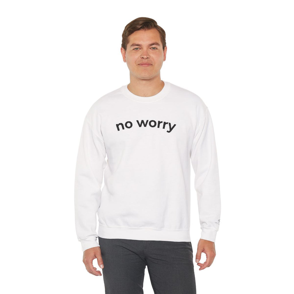 Man standing wearing the white No Worry crewneck, second model