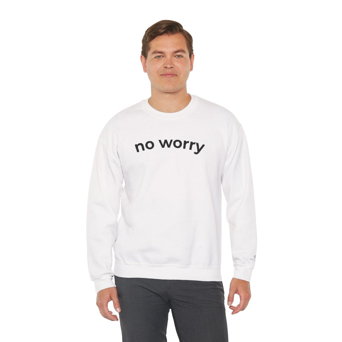 Man standing wearing the white No Worry crewneck, second model