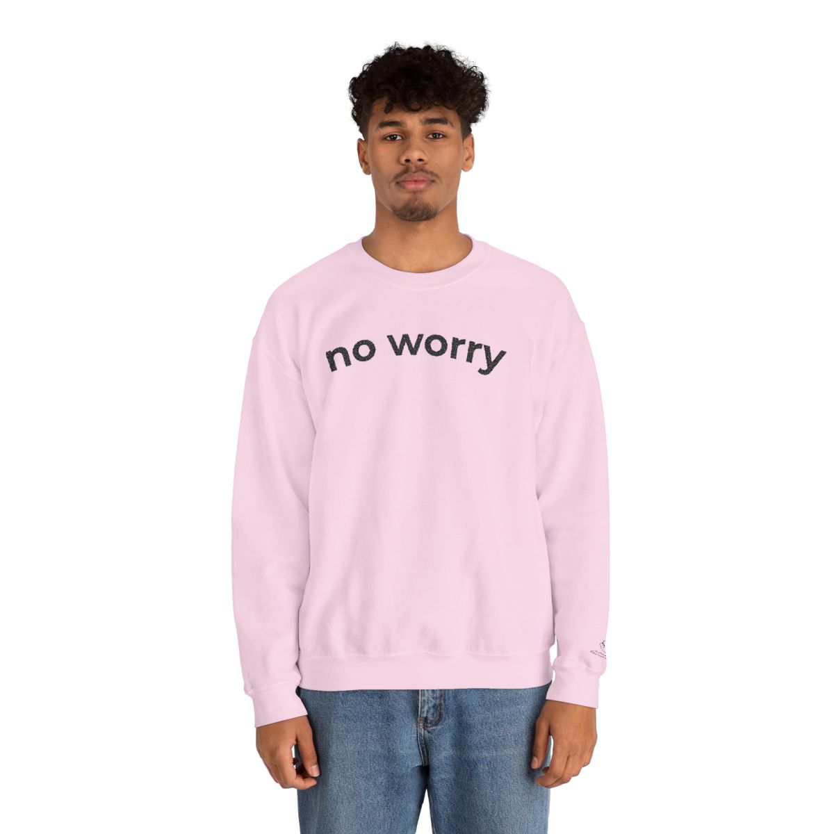 Man standing wearing the light pink No Worry crewneck