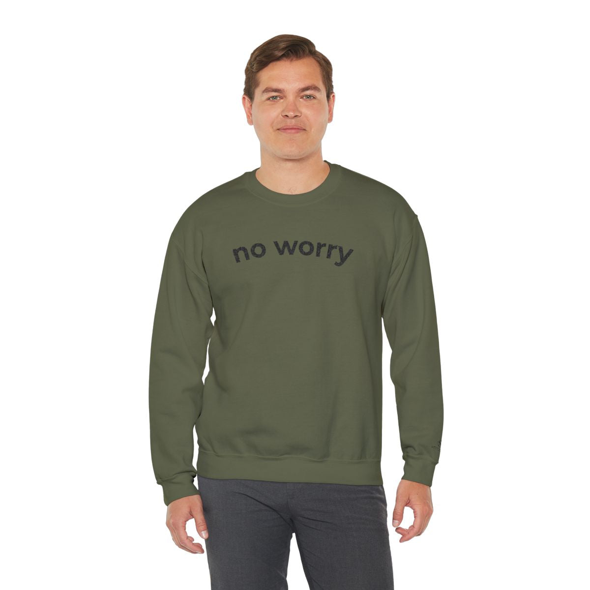 Man standing wearing the military green No Worry crewneck, second model