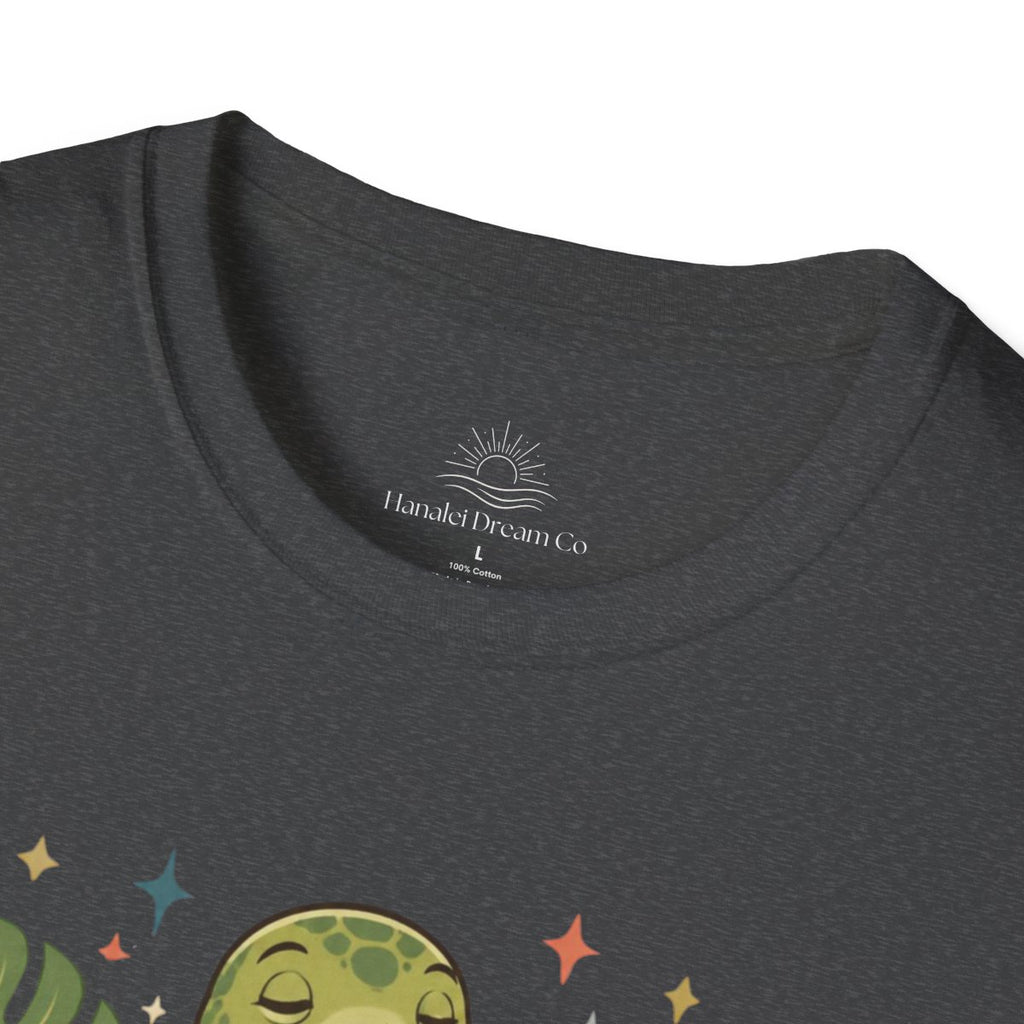 Close-up of the dark heather Professionally Relaxing tee neck logo and turtle print
