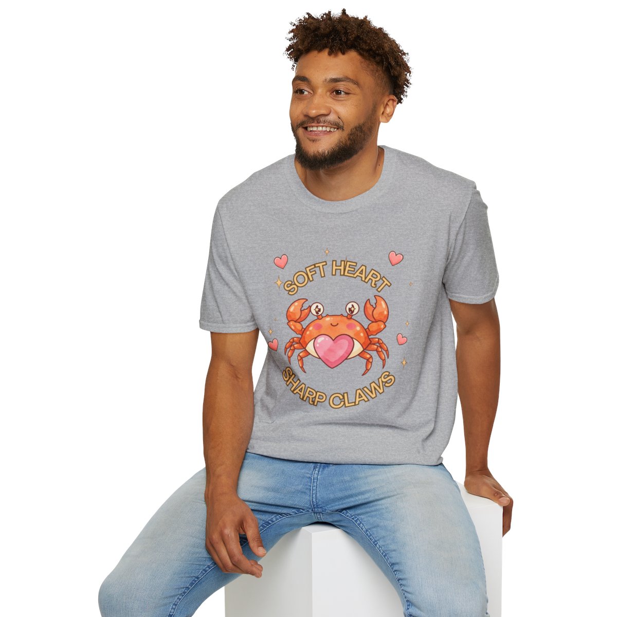 Man sitting wearing the sport grey Soft Heart Sharp Claws crab tee