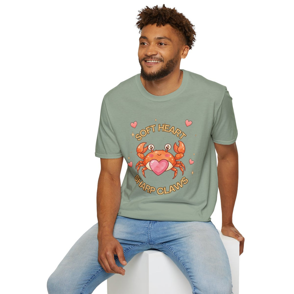 Man sitting wearing the sage Soft Heart Sharp Claws crab tee